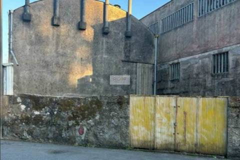 Prédio devoluto usado para indústria com destino a habitação e comércio