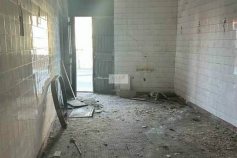 Prédio devoluto usado para indústria com destino a habitação e comércio