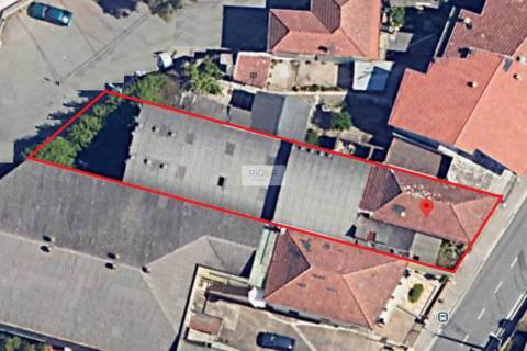 Prédio devoluto usado para indústria com destino a habitação e comércio