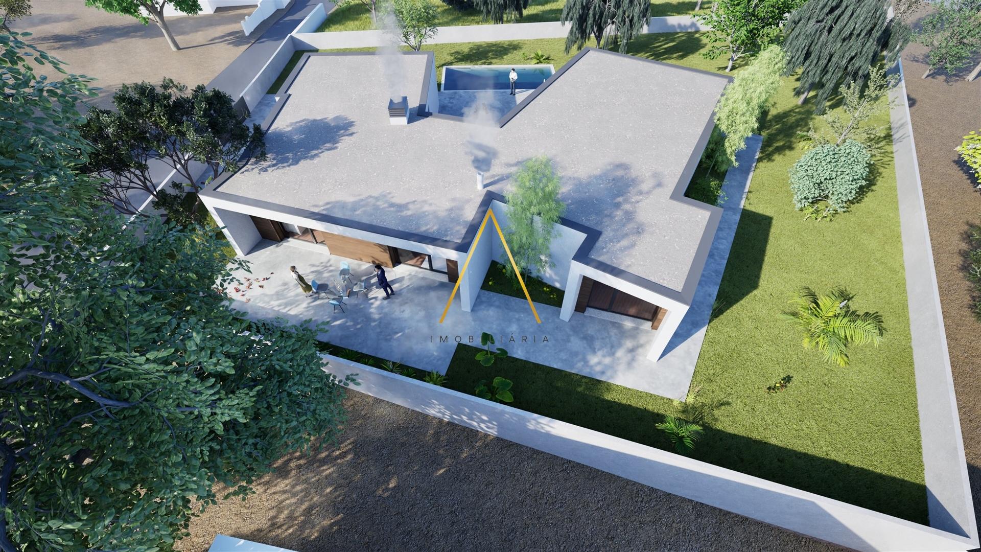 Moradia Isolada T4, inserida em 1352 m2 de terreno.