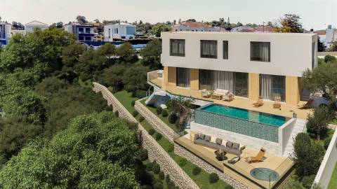 Lote com projeto aprovado para moradia T3 com piscina infinita