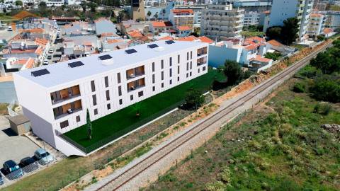 T2 Novo c/ dois lugares garagem e varanda 21,24m2 em Portimão.