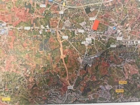Terreno com 23332 m2 com viabilidade de construção de 61 apartamentos com 6249 m2 de área de construção sito nas Ferreiras em Albufeira