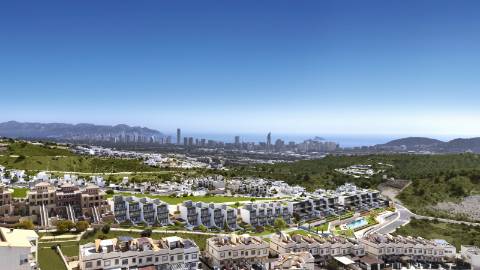 Moradia geminada T3 em construção, com parqueamento.