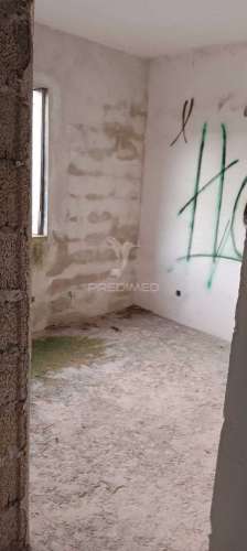 Lote com moradia em construção