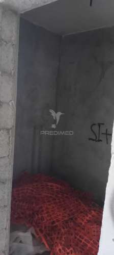 Lote com moradia em construção