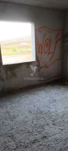 Lote com moradia em construção