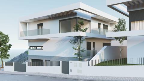 Moradia NOVA, isolada, construída num terreno com 318m2, com piscina e jardim em Famões, Odivelas.